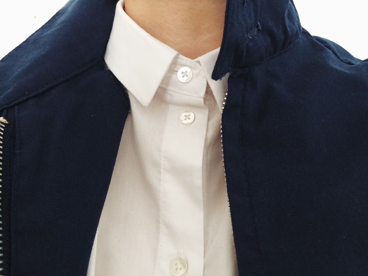 Midsection of man wearing shirt and jacket against white background