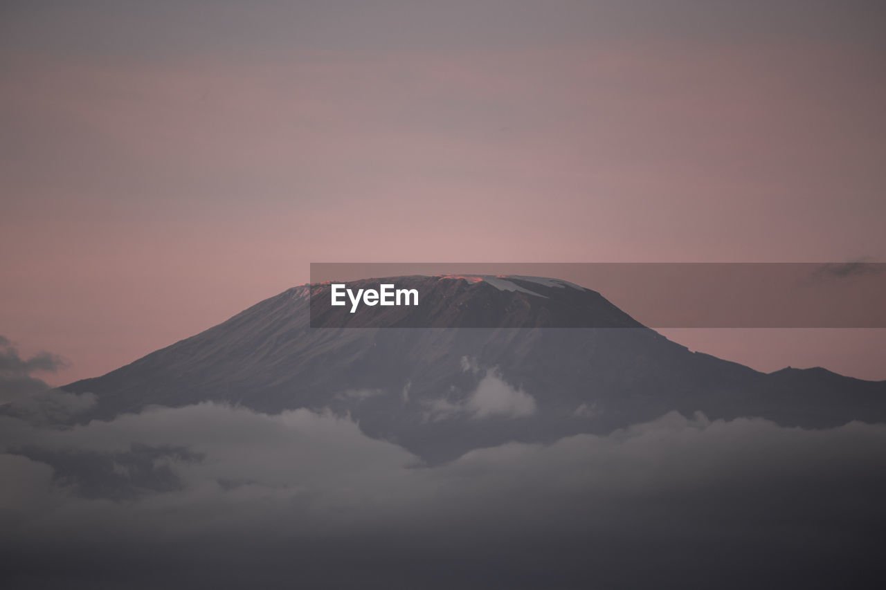 Scenic view of mountains against sky during sunset