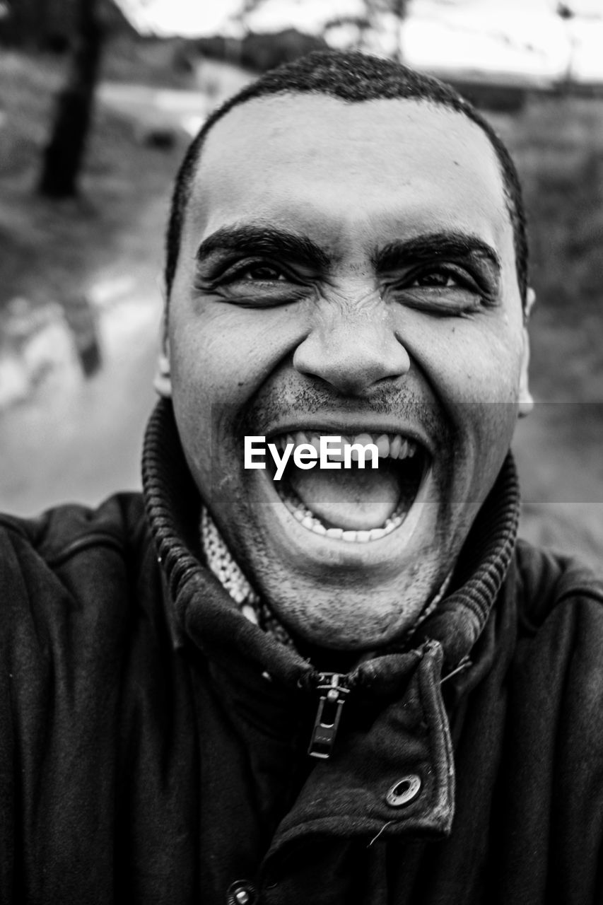 Portrait of excited man shouting