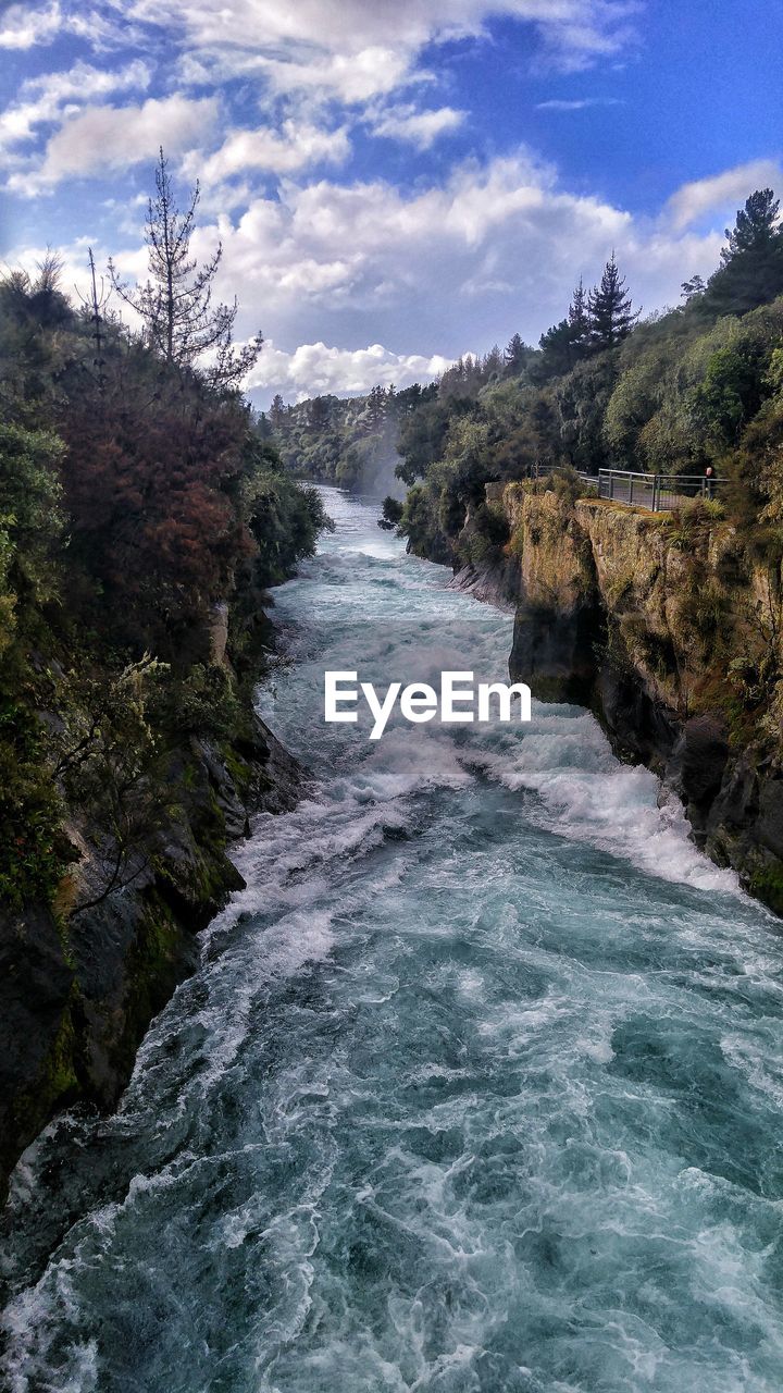 Scenic view of river flowing through rocks