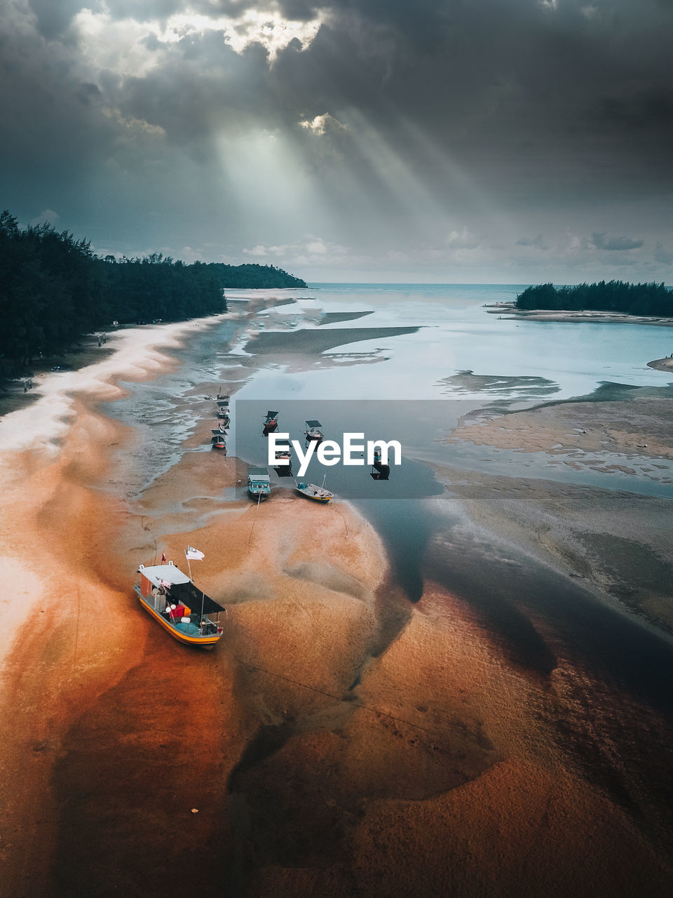 scenic view of beach against sky during sunset