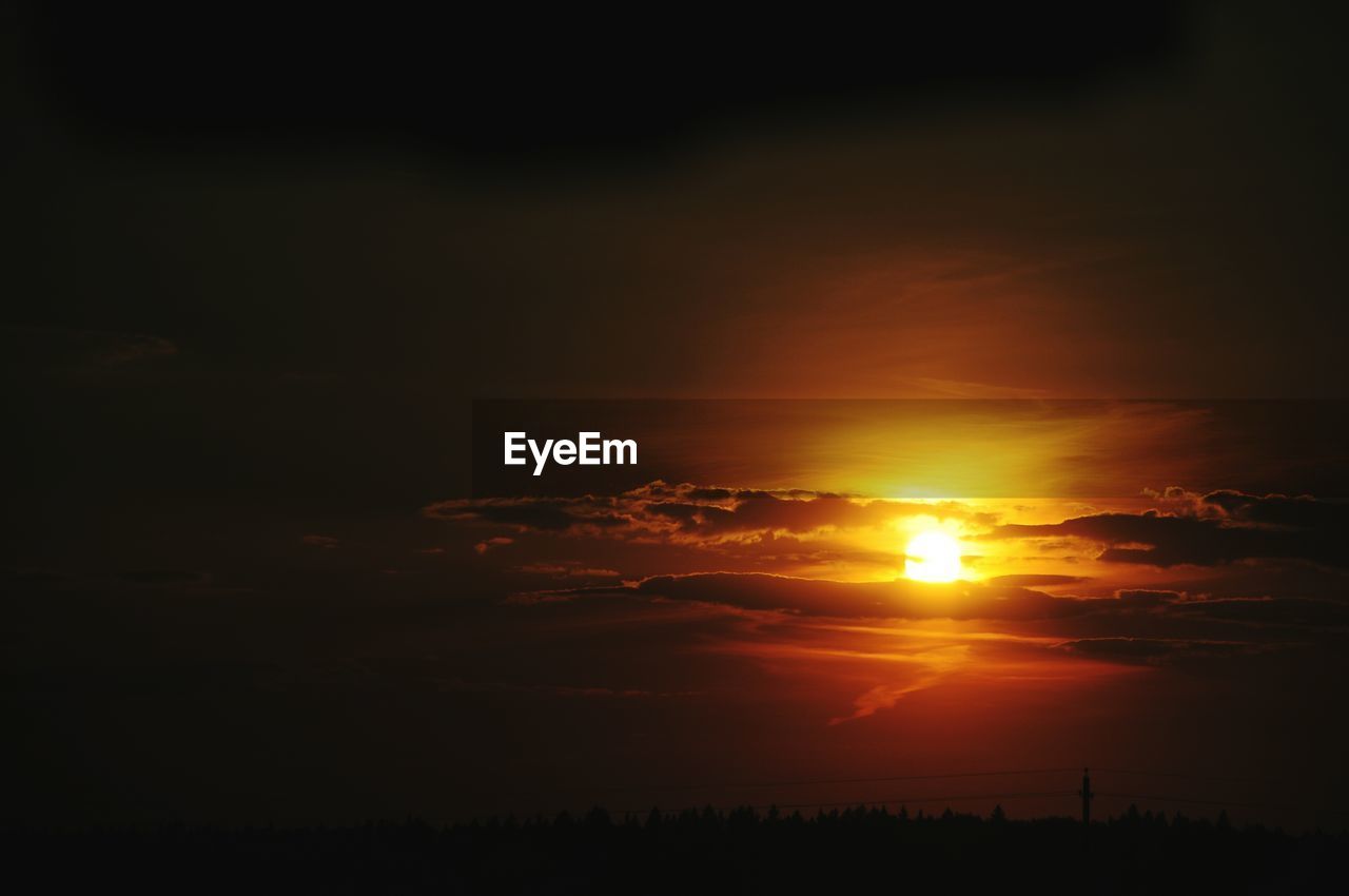 Scenic view of silhouette landscape against sky during sunset