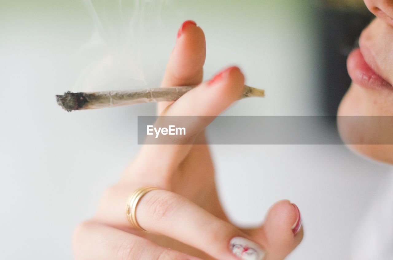 Close-up of woman smoking weed