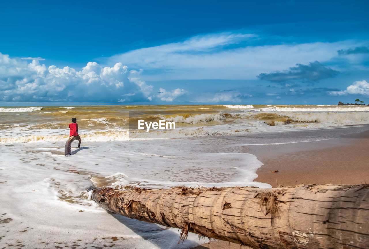 A boy from the fishing village of axim who, in his spare time, enjoys the sea in ghana