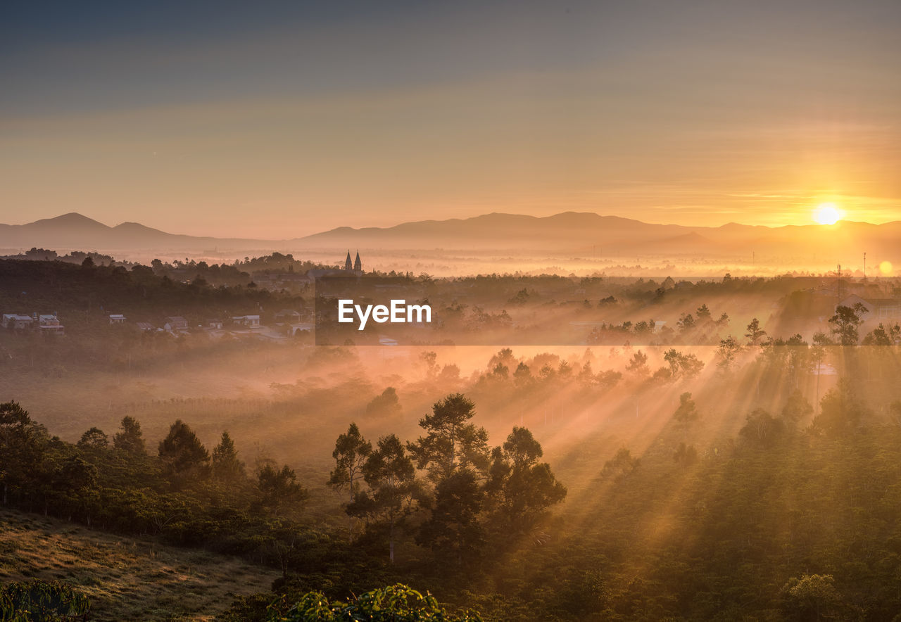 Scenic view of landscape against sky during sunset