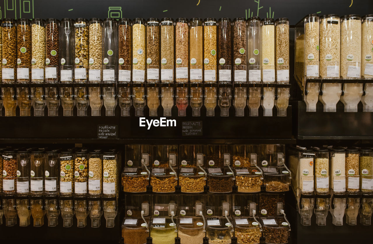 Full frame shot of food in glass bottles for sale at market