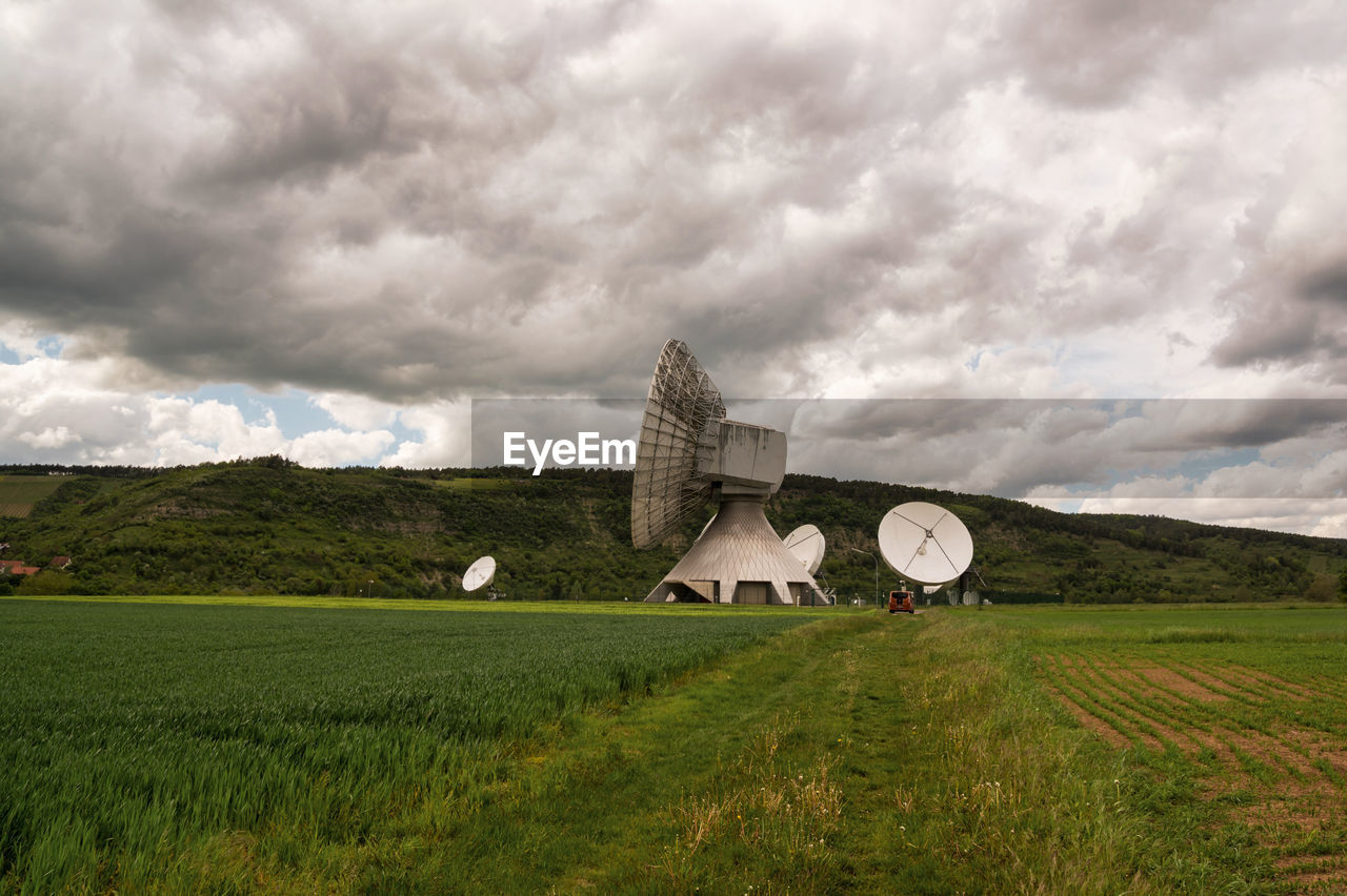 BUILT STRUCTURE ON LANDSCAPE AGAINST SKY