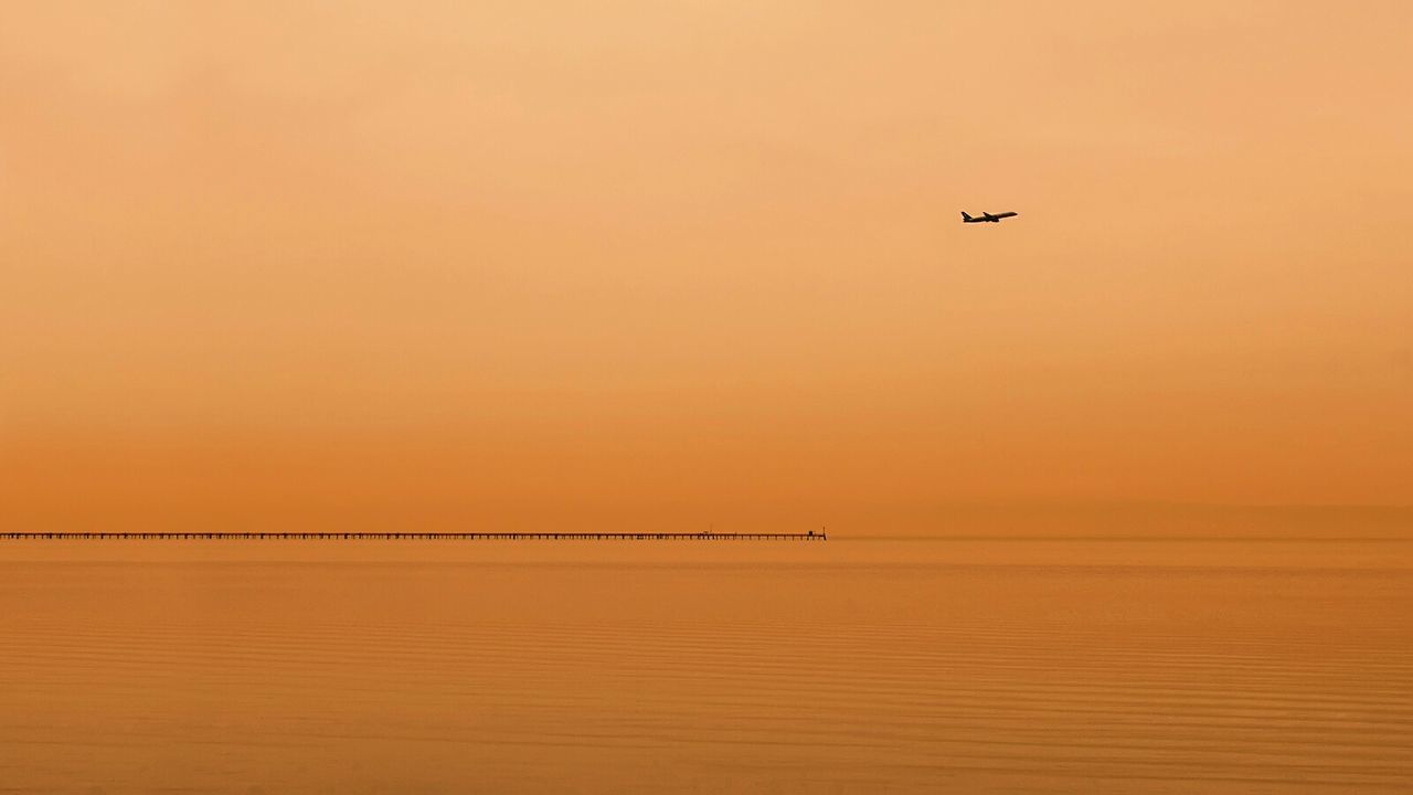 SCENIC VIEW OF SEA DURING SUNSET