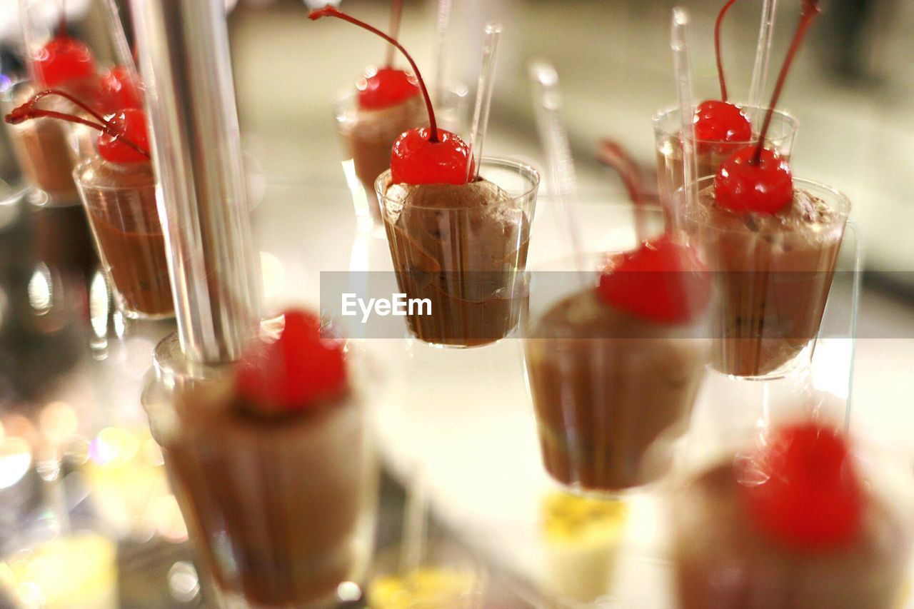 Close-up of dessert in glasses on table