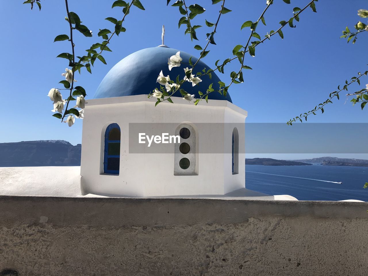 Church in santorini, greece overlooking the water 