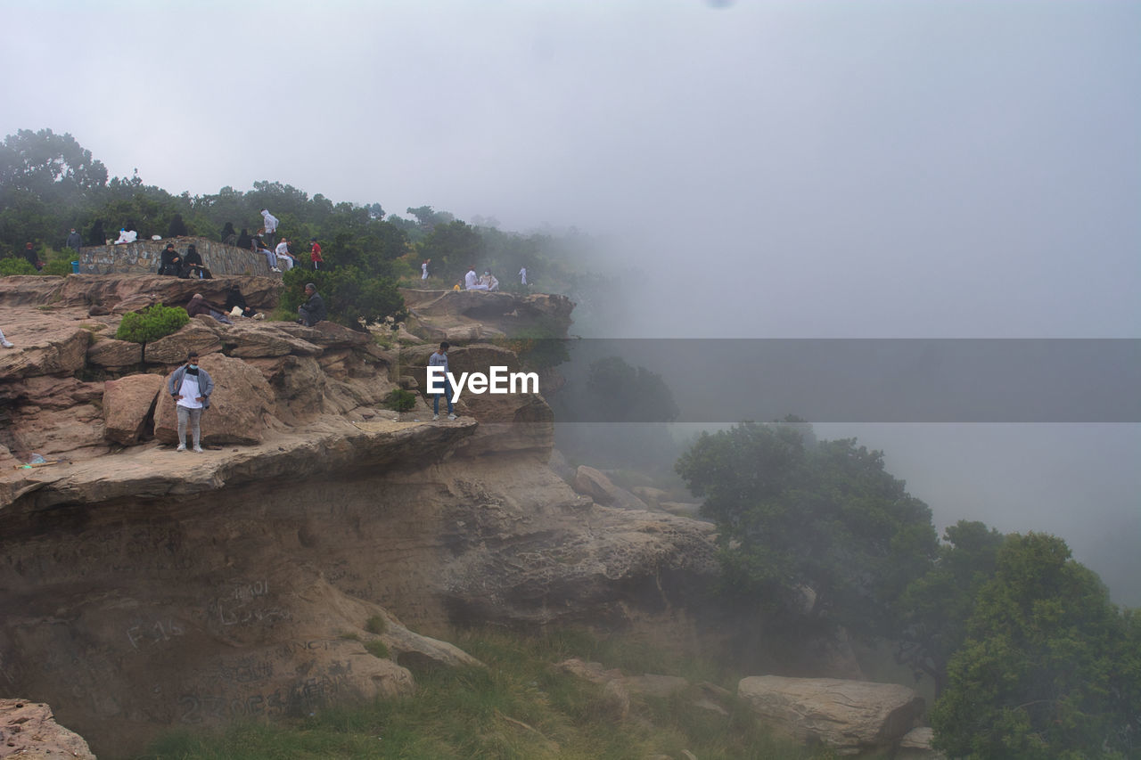 A mountain engulfed in clouds in abha, saudi arabia.