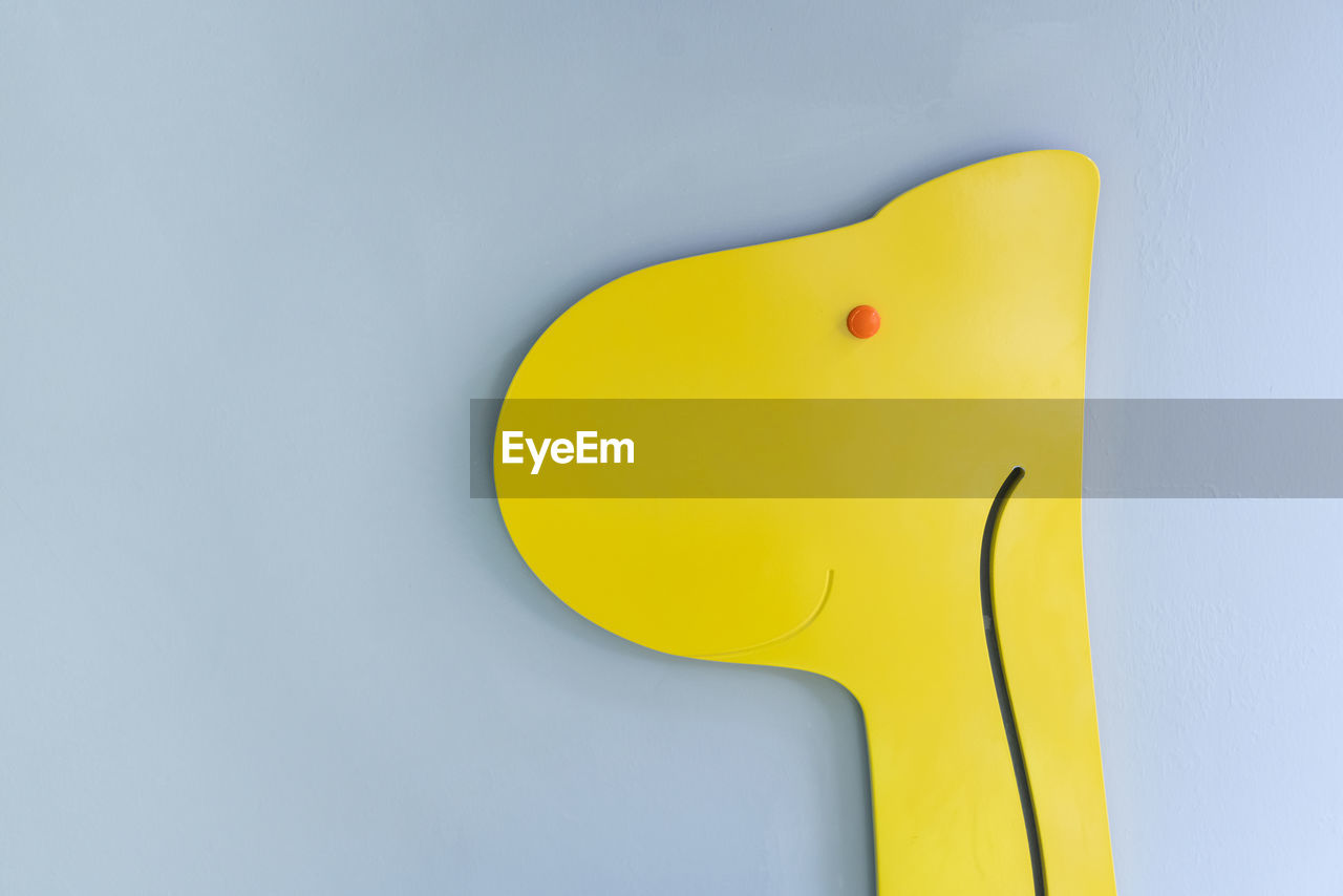 yellow, studio shot, indoors, no people, blue, cartoon, creativity, close-up, simplicity, single object, colored background, copy space, blue background