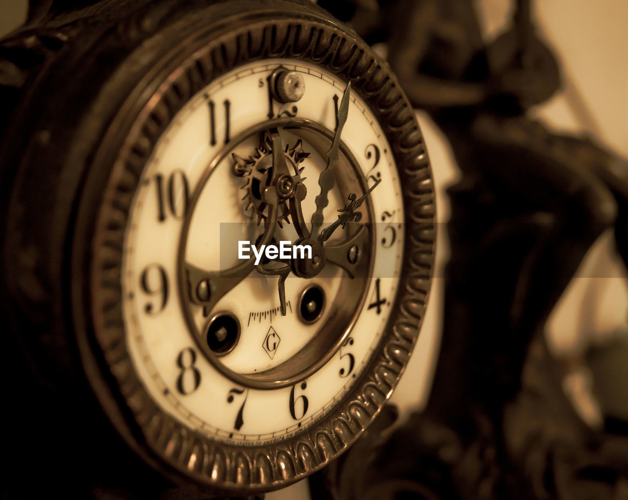 CLOSE-UP OF CLOCK ON METAL