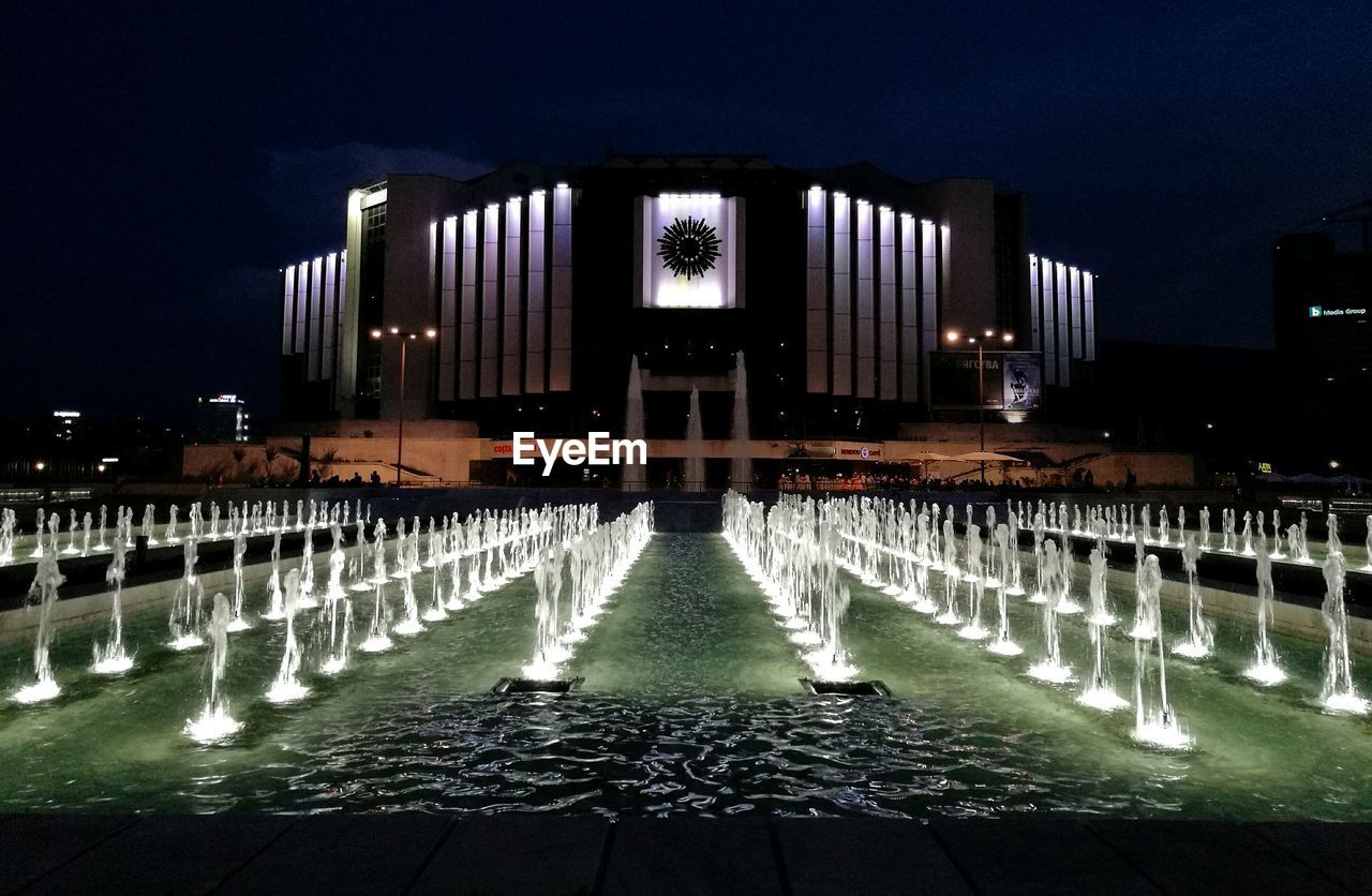 SURFACE LEVEL OF FOUNTAIN AT NIGHT