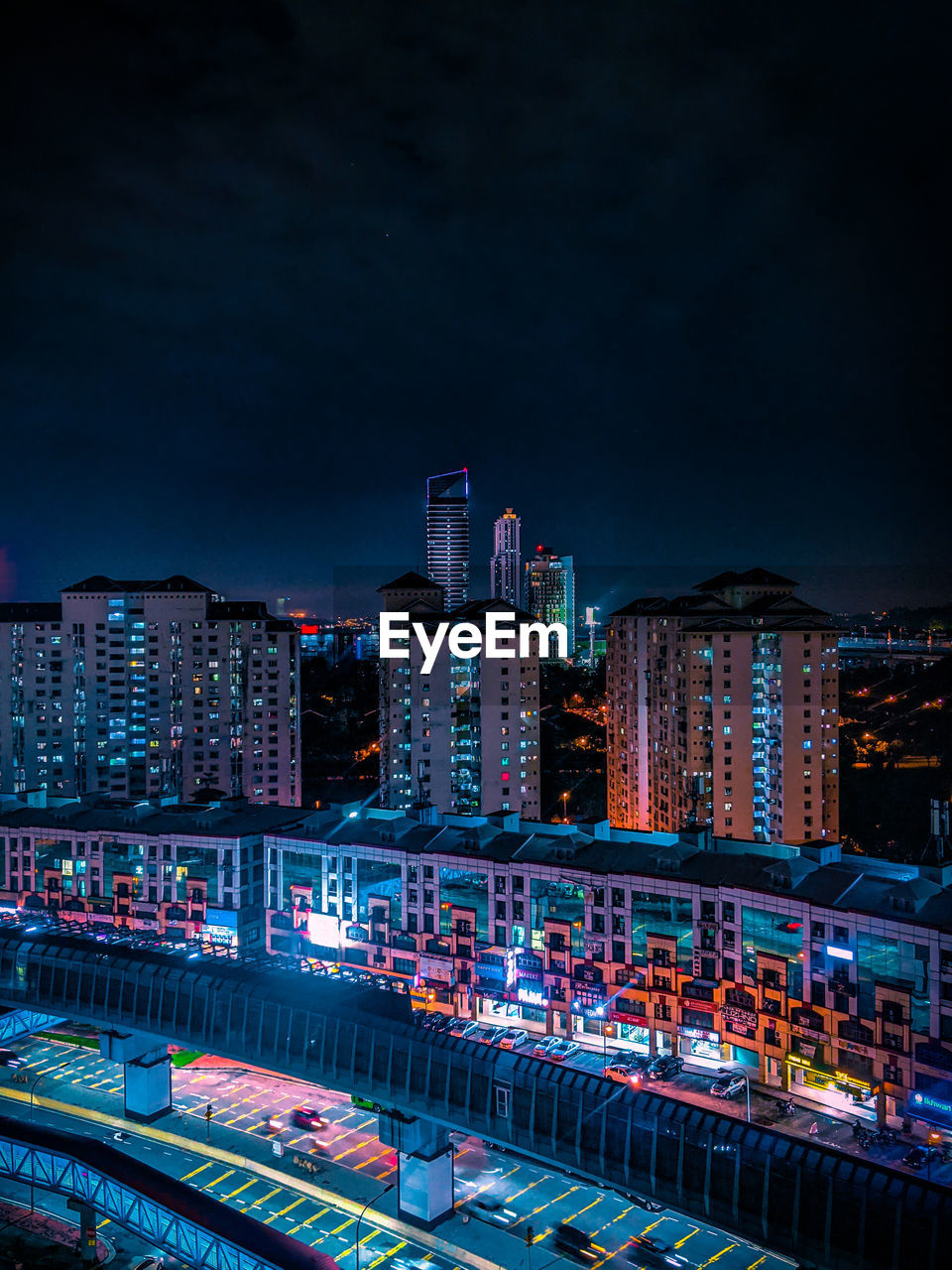 Illuminated buildings in city at night