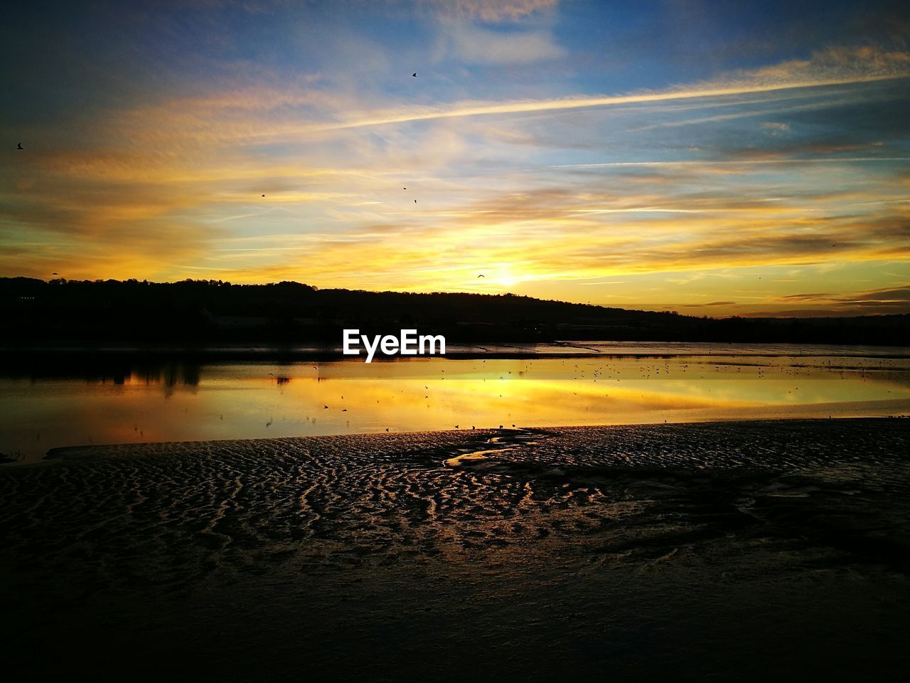 Scenic view of sea against sky during sunset