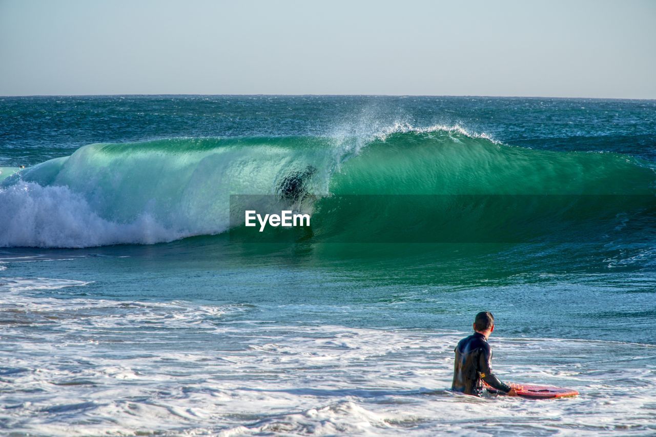 Man surfing in sea