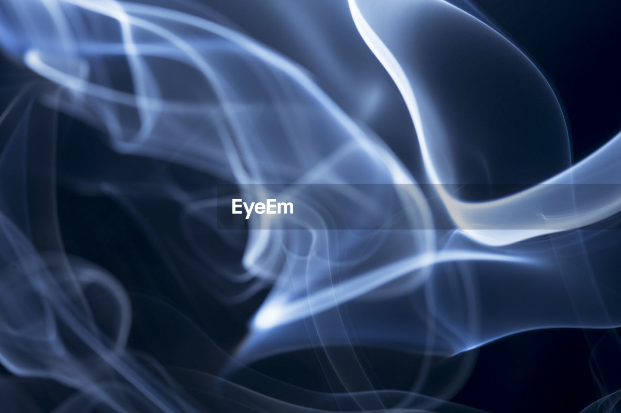 Close-up of smoke against black background