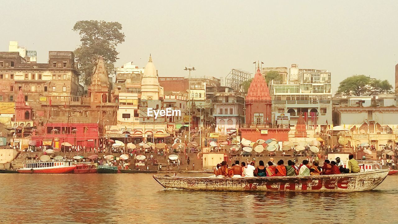 PEOPLE ON BOAT IN RIVER