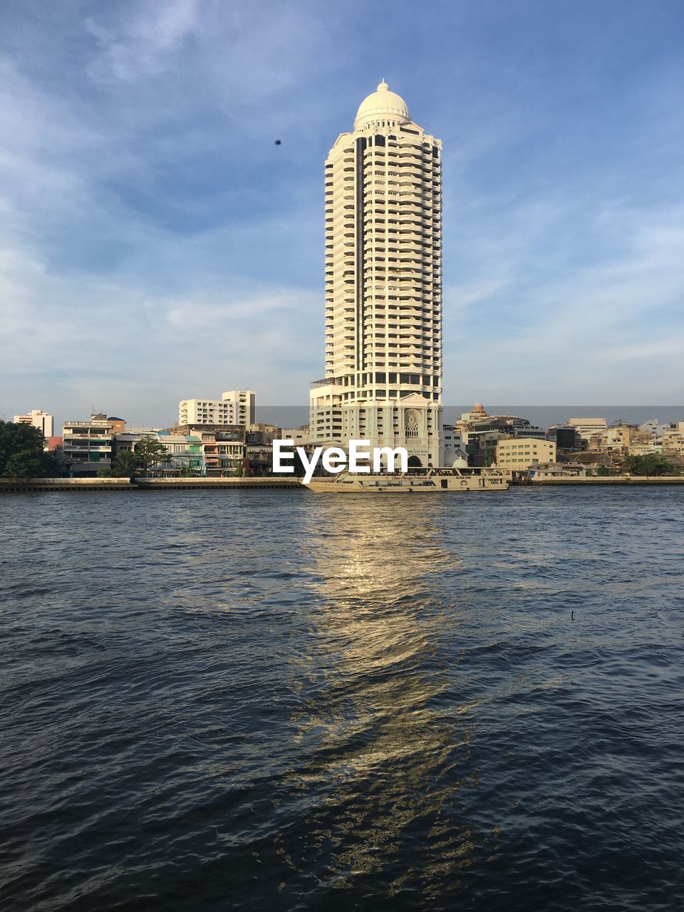 reflection, architecture, built structure, sky, nature, cloud, water, skyscraper, building exterior, tower, day, blue, outdoors, city, no people, travel destinations, sunlight, travel, building, landmark