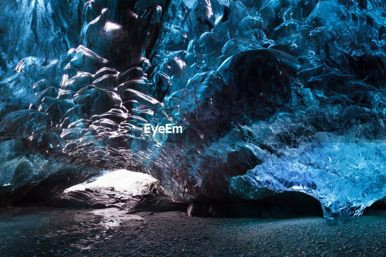 PEOPLE SWIMMING IN CAVE