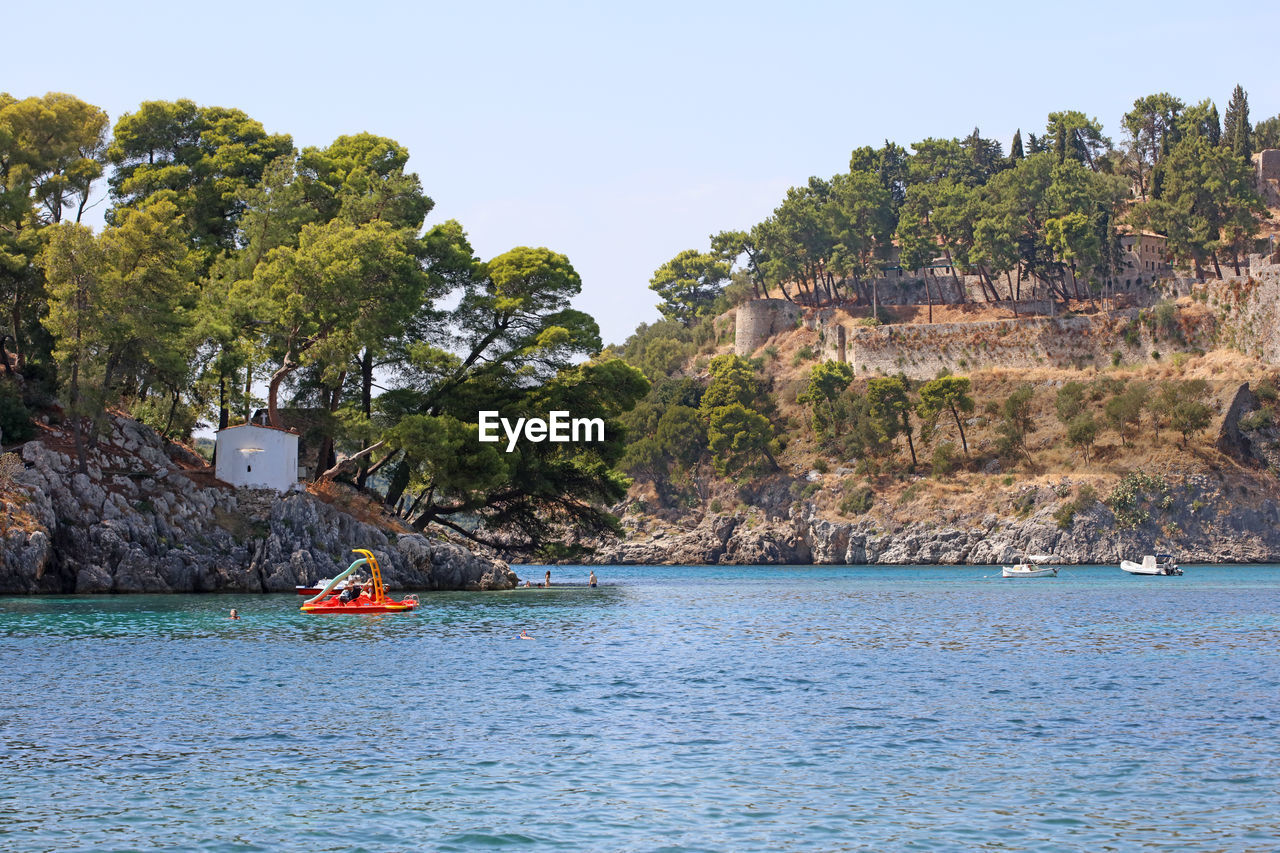 People kayaking in sea