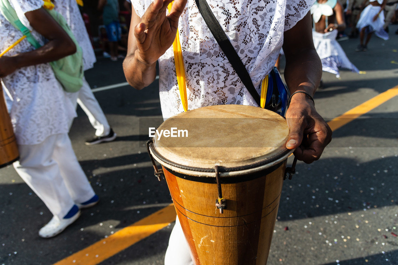 Musicians are seen playing percussion instruments during fuzue, pre carnival 