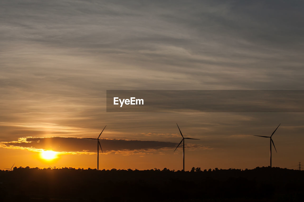 Wind turbine farm at sunset