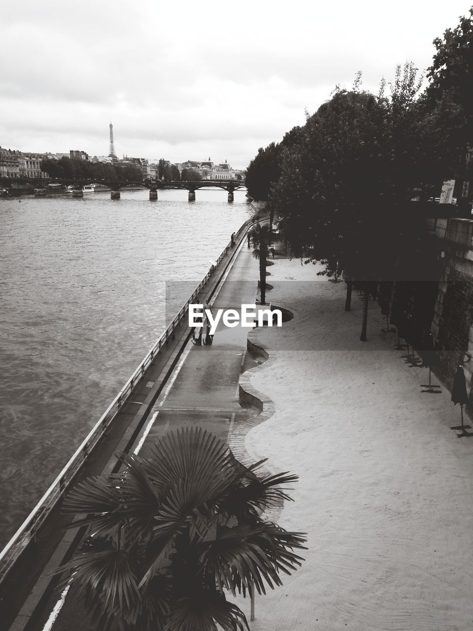 VIEW OF RIVER WITH BUILDINGS IN BACKGROUND