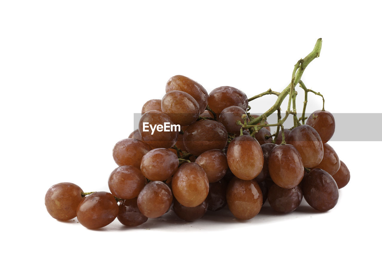 CLOSE-UP OF FRUITS OVER WHITE BACKGROUND