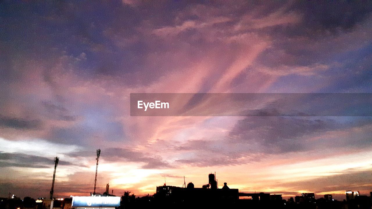 SILHOUETTE OF BUILDINGS AT SUNSET