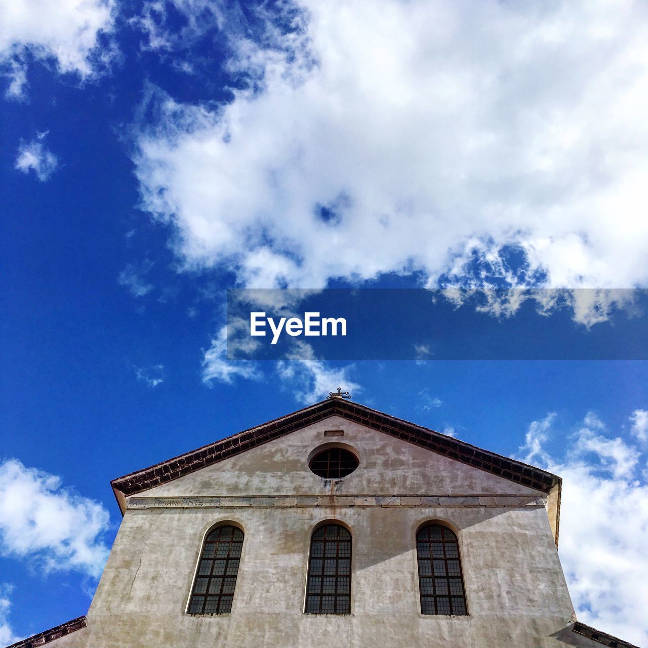 Low angle view of building against blue sky