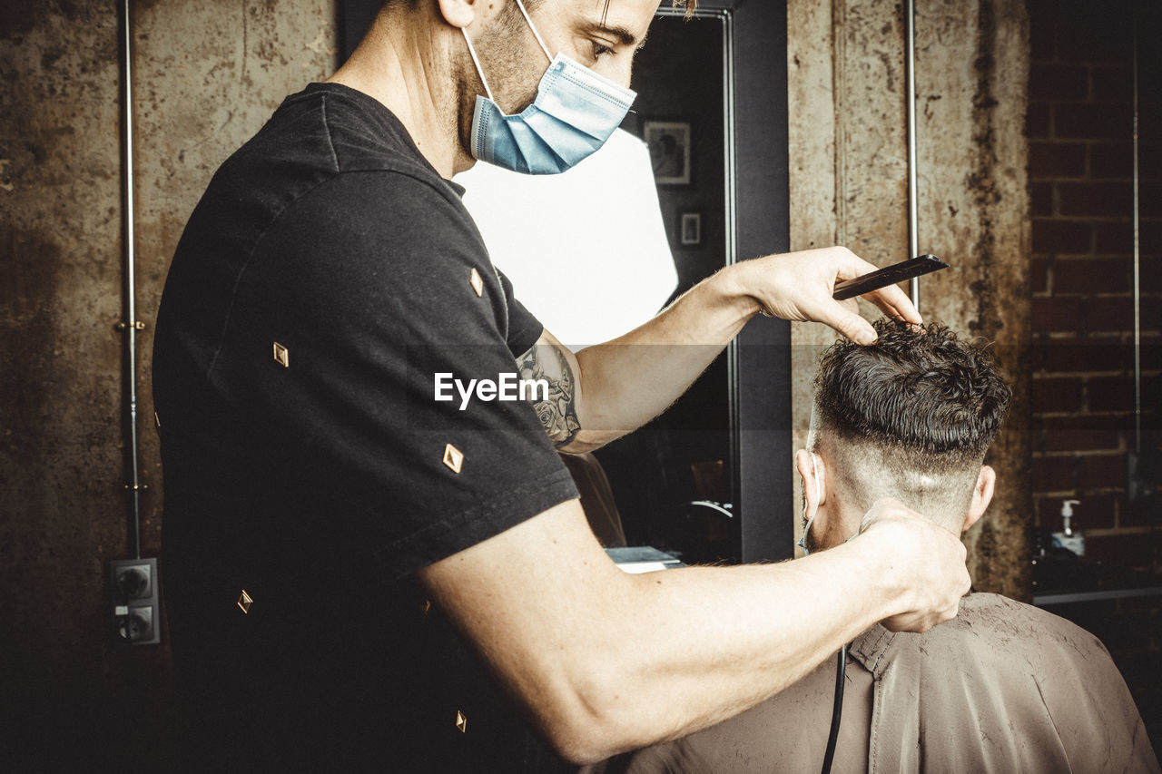 Beautician and hairdresser working with mask for the covid19 virus