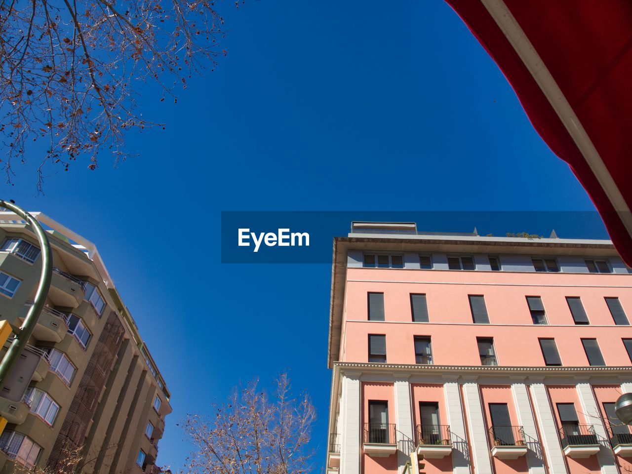 Low angle view of building against clear blue sky