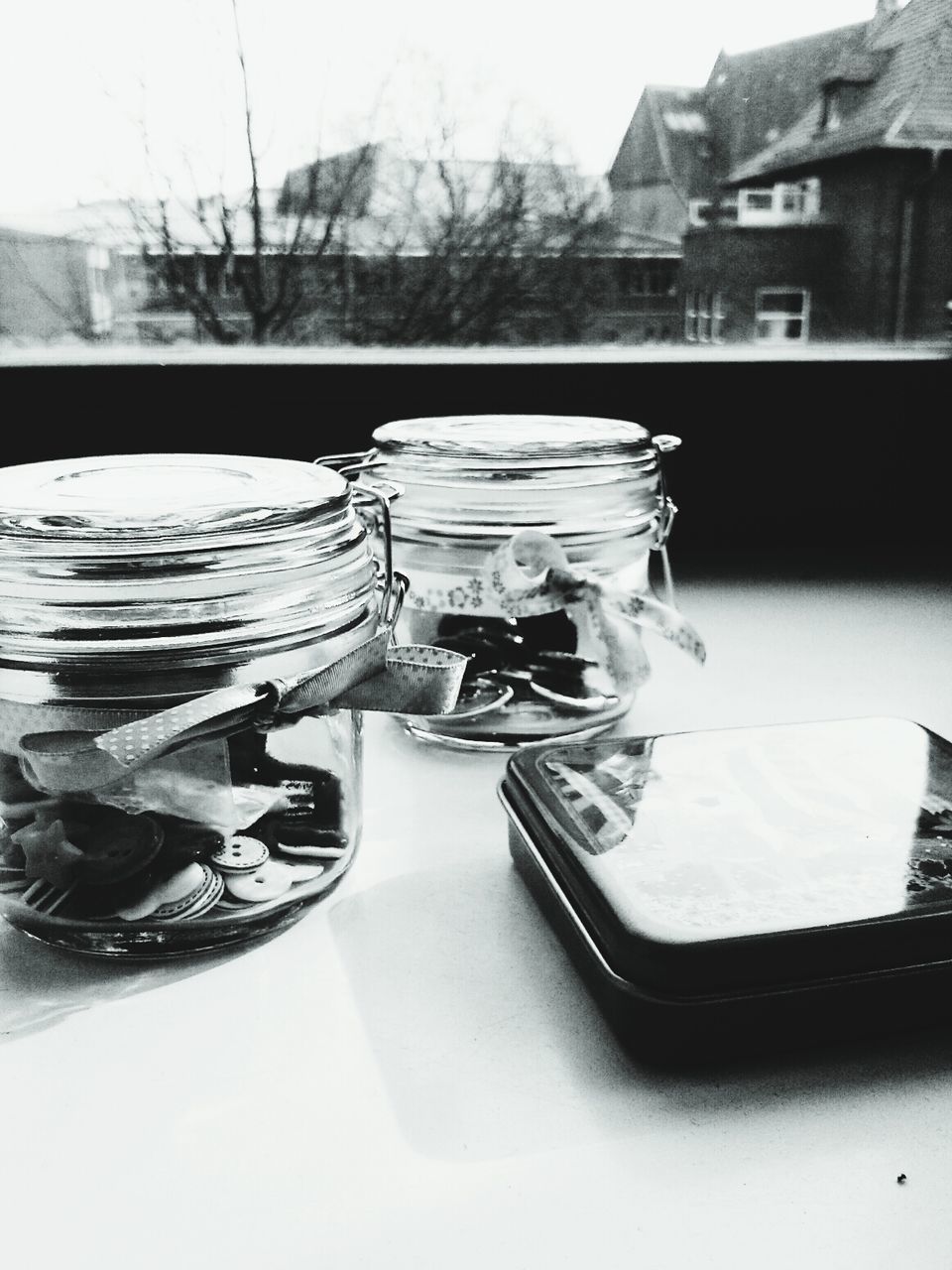 Box and jars on table