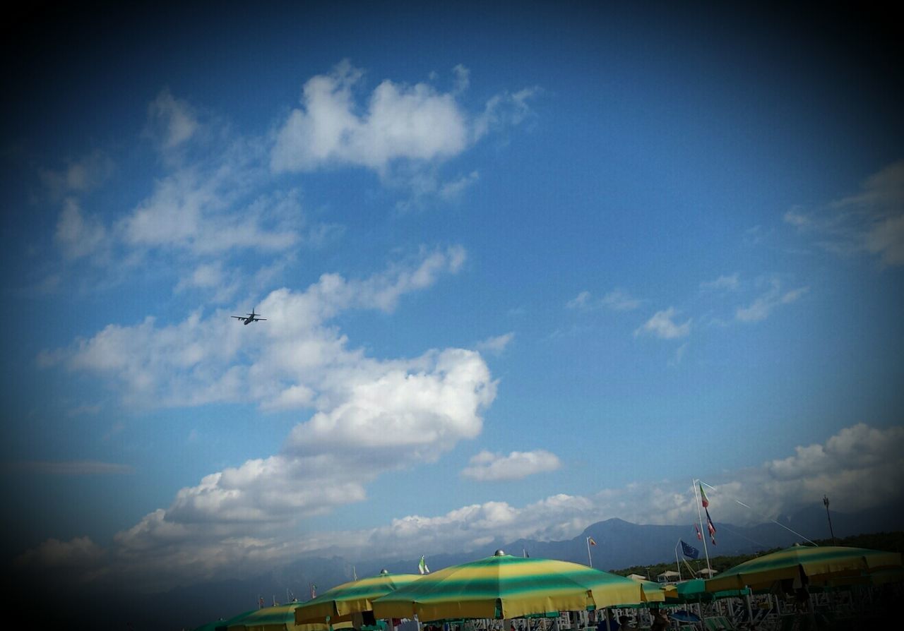 Low angle view of airplane flying against sky