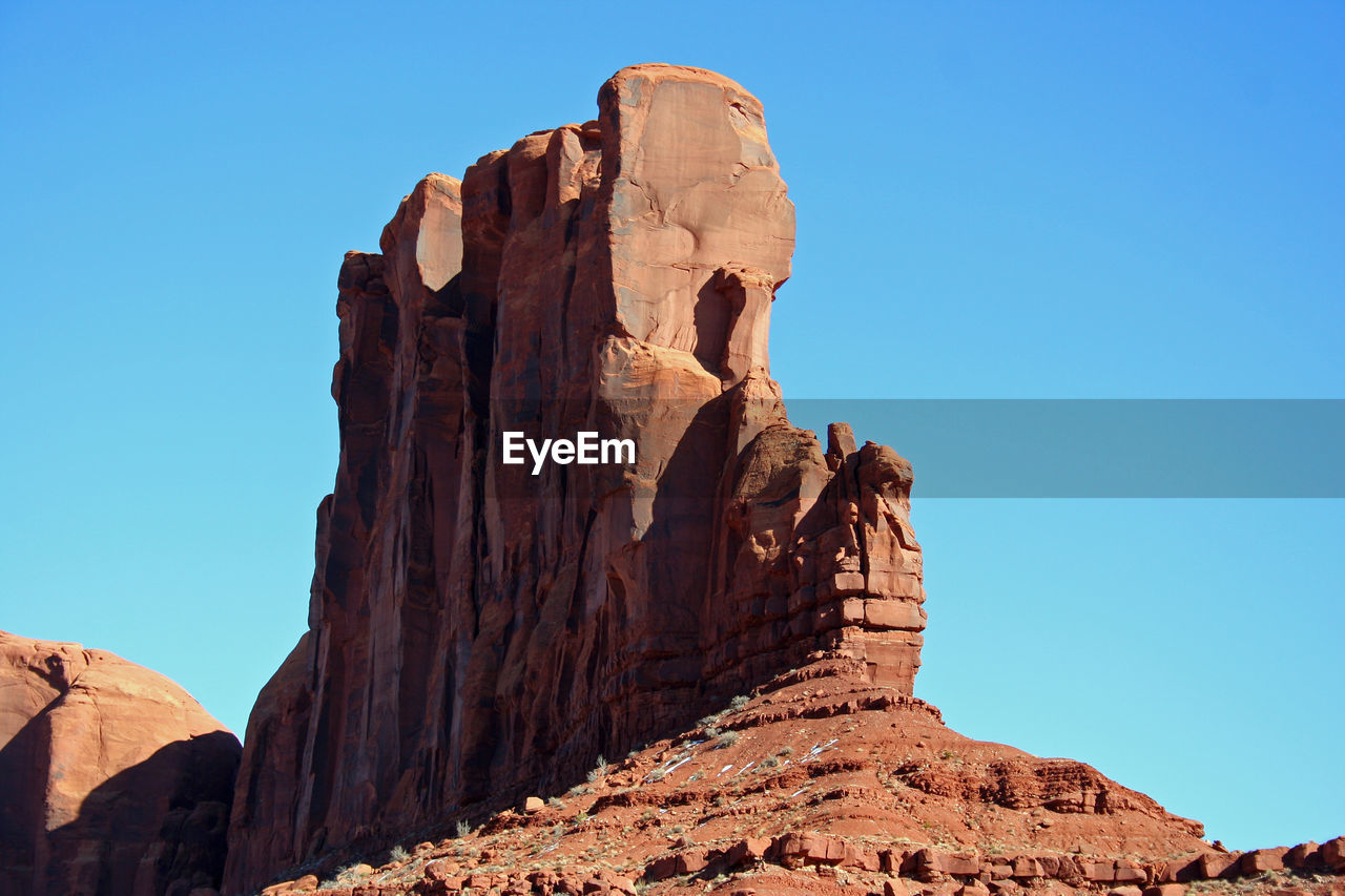 LOW ANGLE VIEW OF ROCK FORMATION