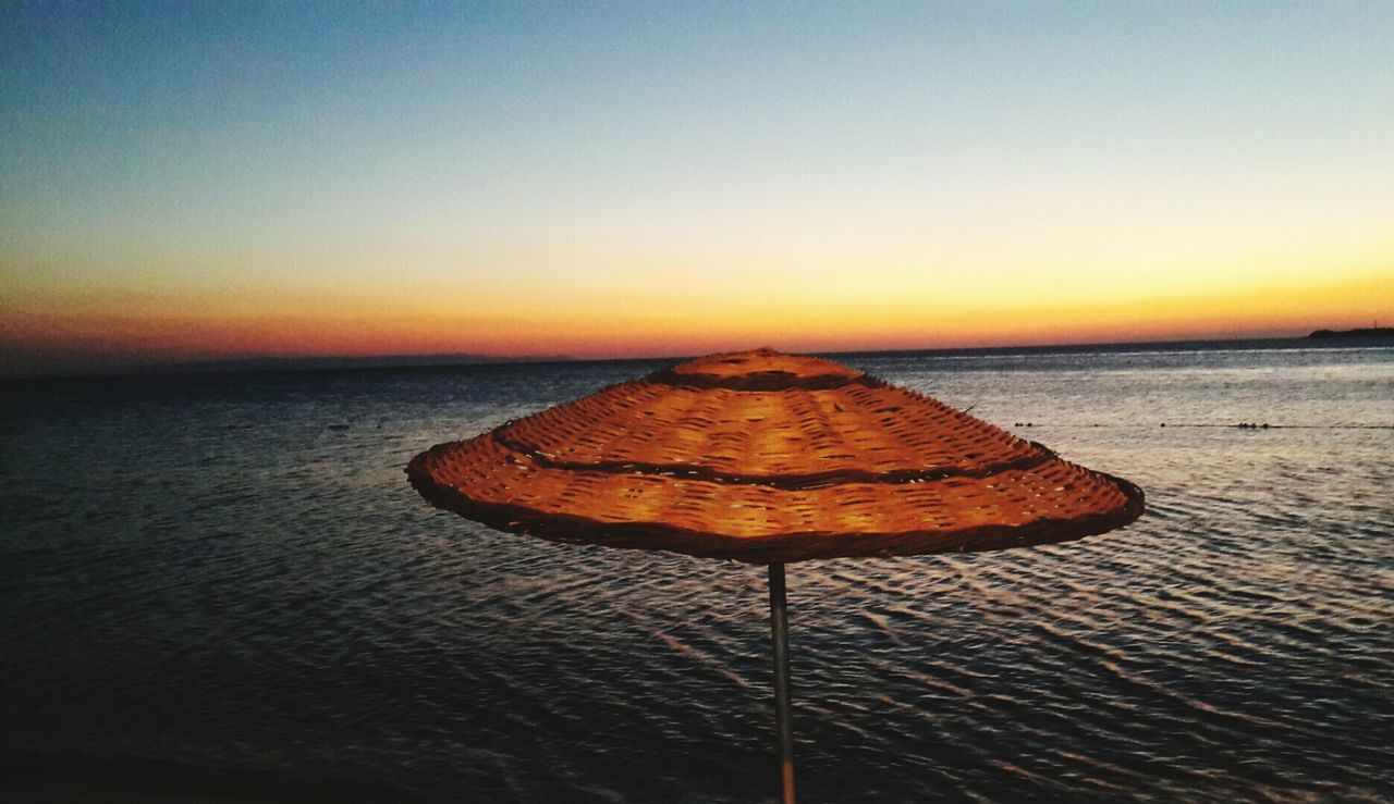 VIEW OF SEA AT SUNSET