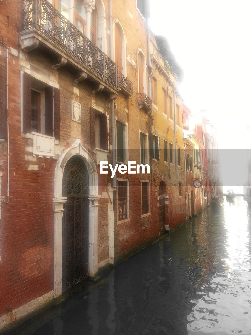 VIEW OF CANAL ALONG BUILDINGS