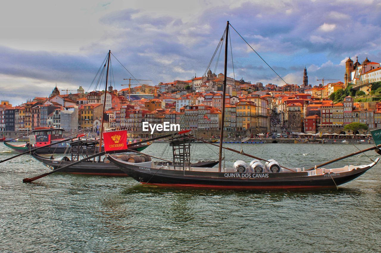 Boats with port wine barrels in harbor, in duoro river 