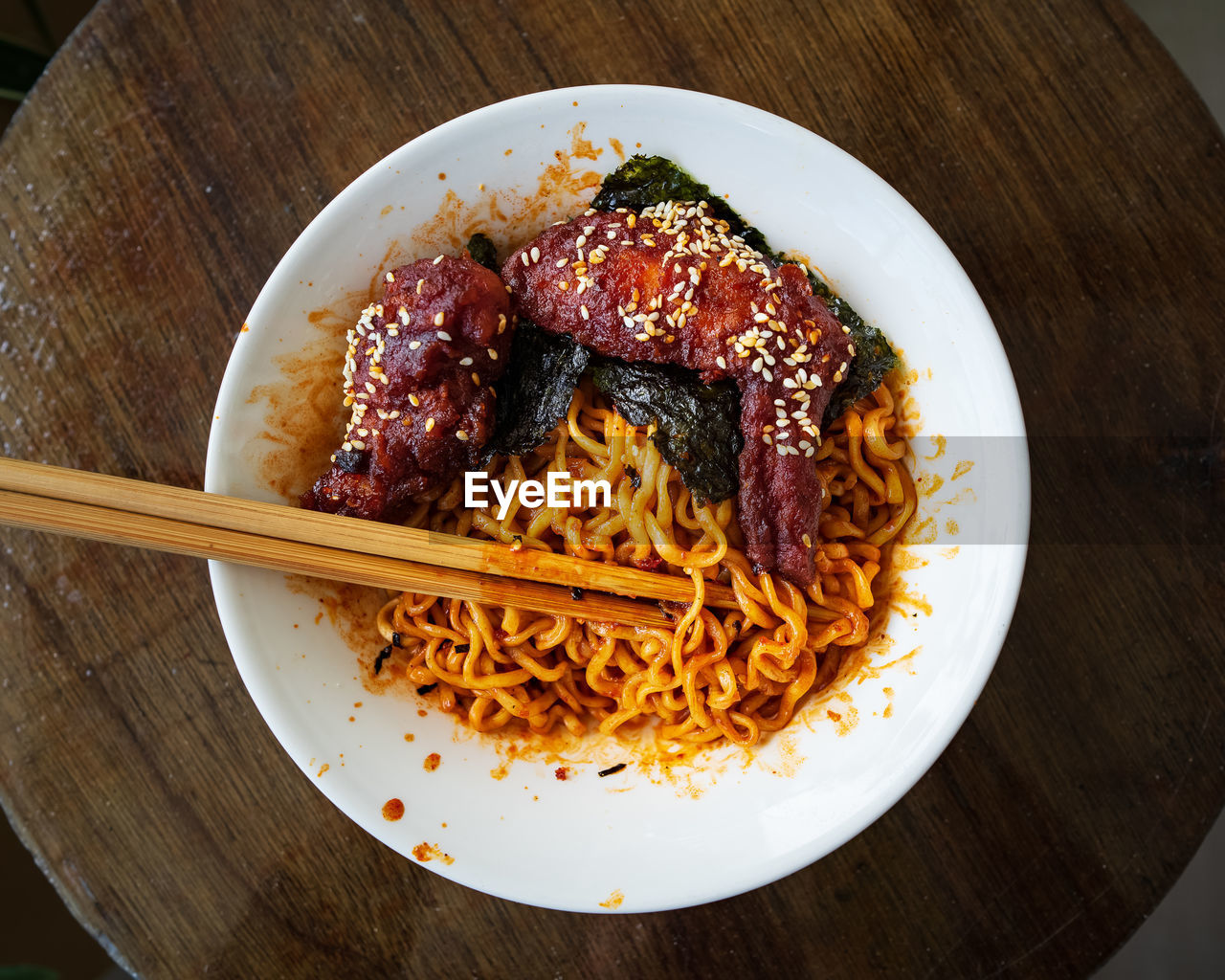 Korean hot spicy fried chicken served with ramen instant noodles, stir fried noodle.