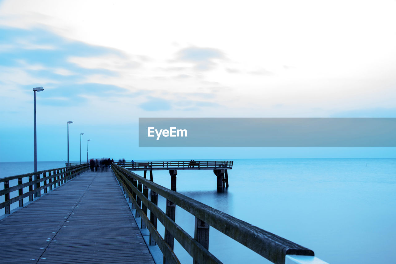 Pier over sea against sky