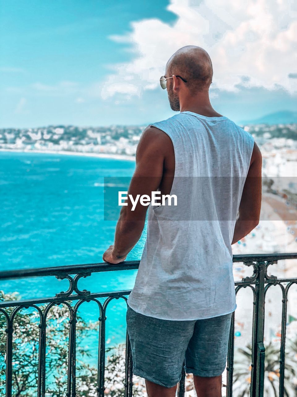 Rear view of man looking at beach