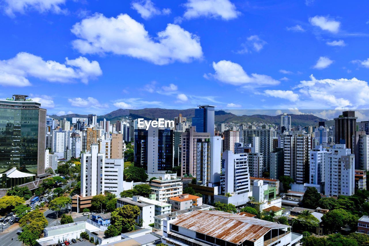 High angle view of buildings in city against sky