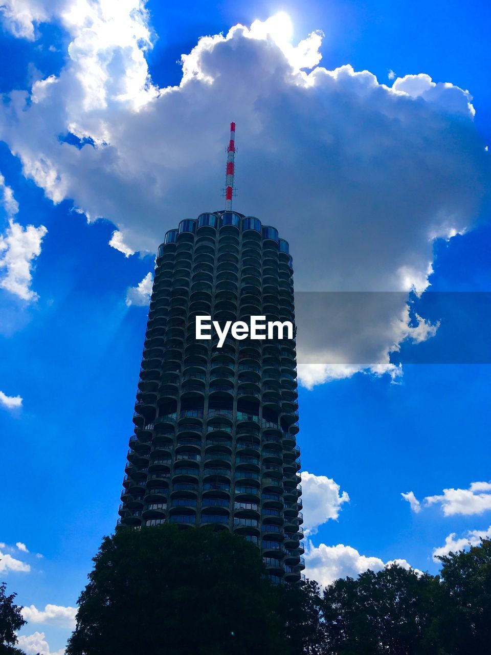 LOW ANGLE VIEW OF BUILDING AGAINST BLUE SKY