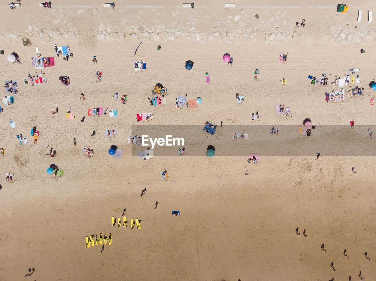 HIGH ANGLE VIEW OF PEOPLE ENJOYING AT BEACH