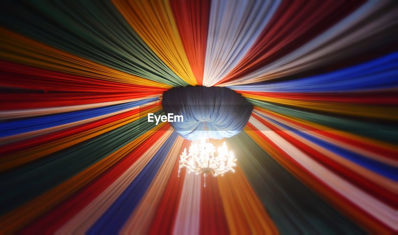 LOW ANGLE VIEW OF ILLUMINATED LIGHT PAINTING