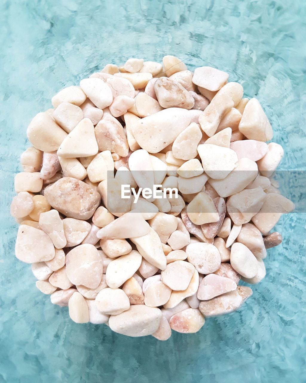 High angle view of pebbles on table