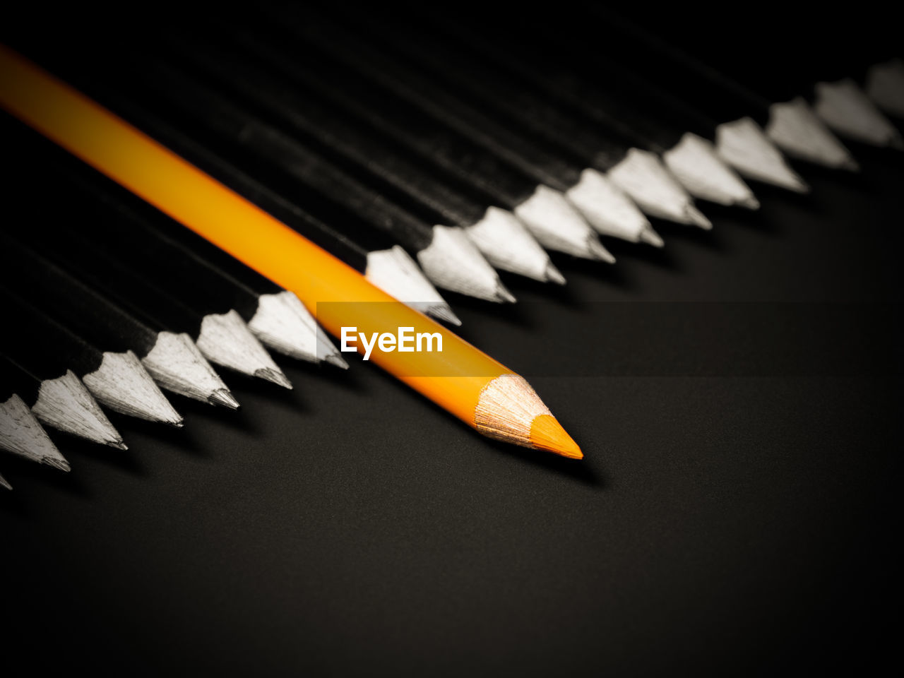 High angle view of pencils on black background