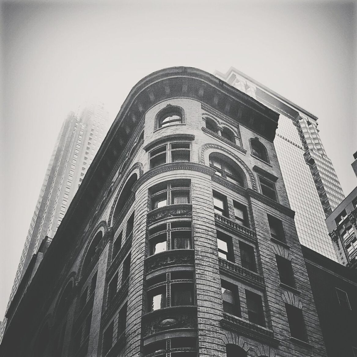 LOW ANGLE VIEW OF SKYSCRAPERS AGAINST CLEAR SKY